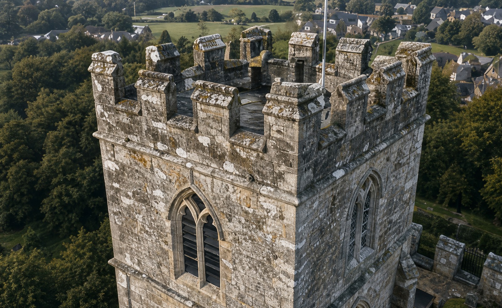 Close aerial view of historic stone tower walls